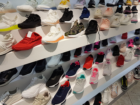 shoes-sport-in-front-store-buing-in-market-center-picture-id1147089911.jpg